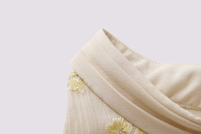 Yellow embroidered sleeveless blouse