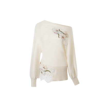 A beige embroidered woolen top