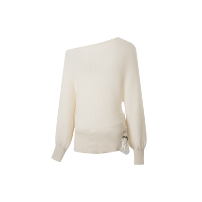 A beige embroidered woolen top